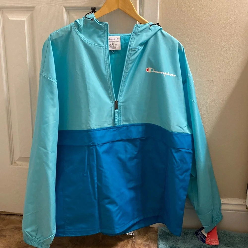 A blue champion rain coat - Picture 1 of 3